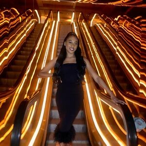 Elegant Black Strapless Dress with Feather Hem